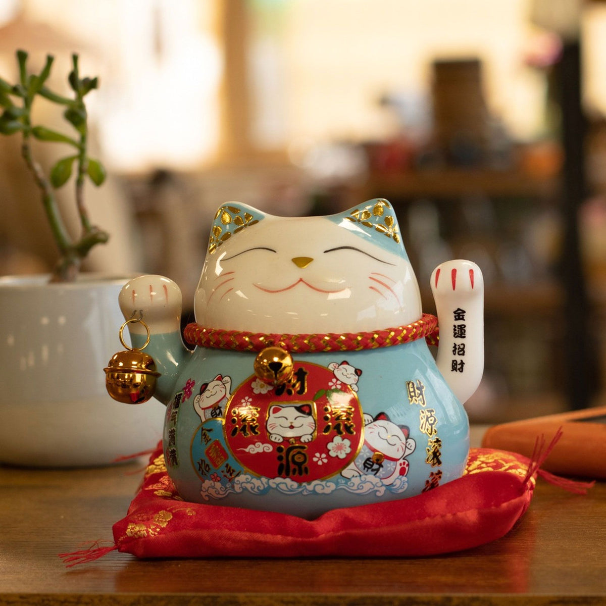 Ceramic Money Cat Moving Hand  - Blue on Cushion